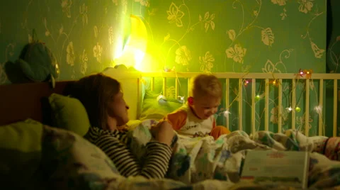 Boy Jumping in Bed Stock Footage 56724870