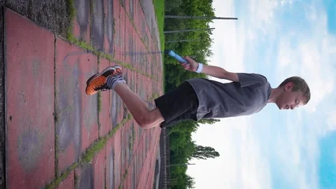 A boy is jumping on a blue rope Video stock 277408856