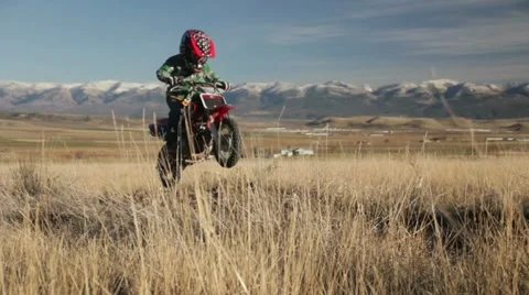Boy jumping motorcycle slow motion HD9307 Stock Footage 12539105