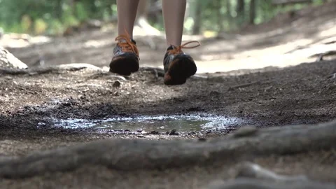 Boy Jumping in Mud Puddle Slow Motion Stock Footage 86881627