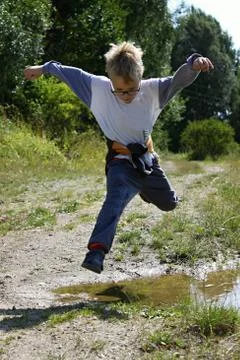 Boy is jumping Stock Photos