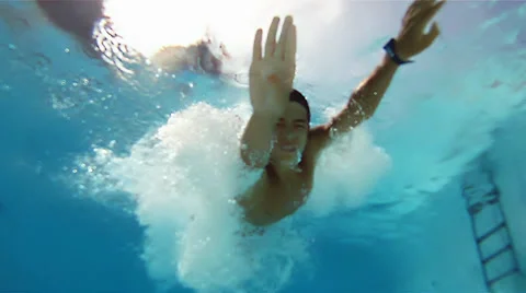 Boy jumping into the pool Stock Footage 33357093