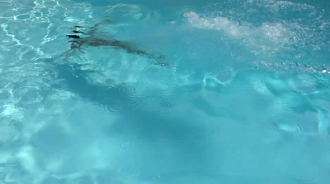 Boy jumping into the pool Video stock 33364087