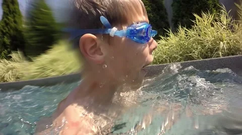 Boy jumping in the pool. Underwater view. Video stock 65881792