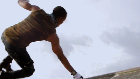 Boy jumping on the ramp with one hand,in slow motion. Видео 110810496