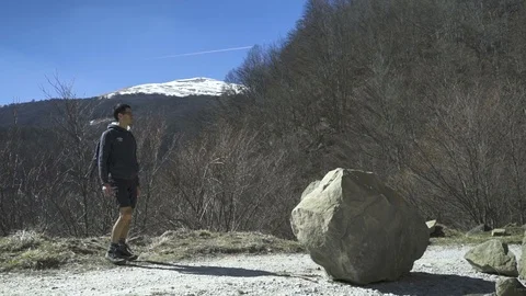 Boy Jumping on a Rock Mountain Video stock 116493589