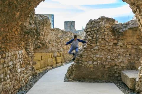 Boy jumping in a ruins Stock Photos