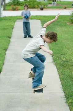 Boy jumping with skateboard Stock Photos