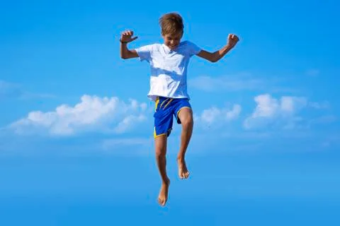 Boy jumping into the sky Stock Photos