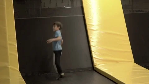 Boy jumping on a trampoline Stock Footage 72996937