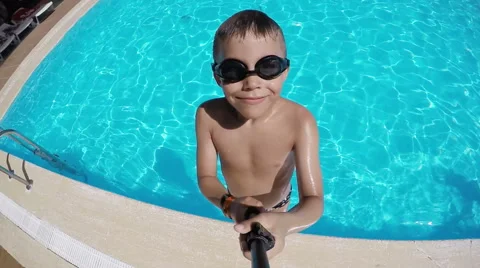 Boy jumps into pool Stock Footage 55302919