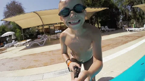Boy jumps into pool Stock Footage 55302922