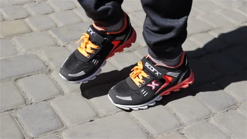 Boy jumps in sneakers Stock Footage 90263068