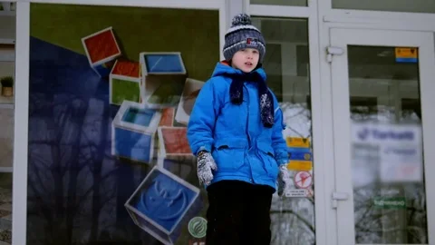 A boy jumps in the snow Stock Footage 85359810