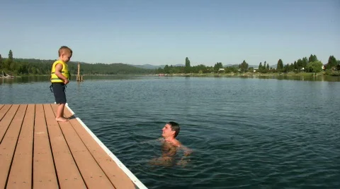 Boy Jumps into Water Stock Footage 364616