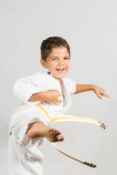 Boy karate kick Stock Photos