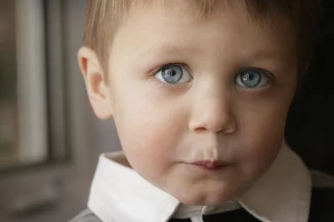 Boy Keeping A Secret Stock Photos