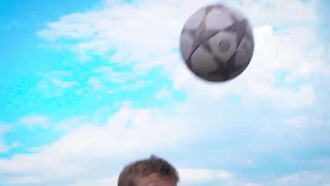 A boy kicks and prepares to head Stock Footage 277408728