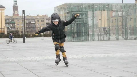 A Boy Kid happy riding Roller Skates at the City Day Stock Footage 87030033