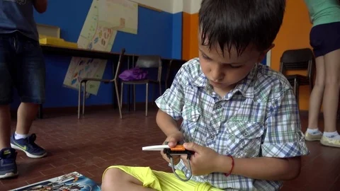 Boy Kid Playing With Lego Construction Blocks Stock Footage 77209316