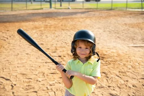 Boy kid posing with a baseball bat. Portrait of child playing baseball. Stock Photos