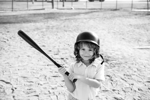 Boy kid posing with a baseball bat. Portrait of child playing baseball. Stock Photos