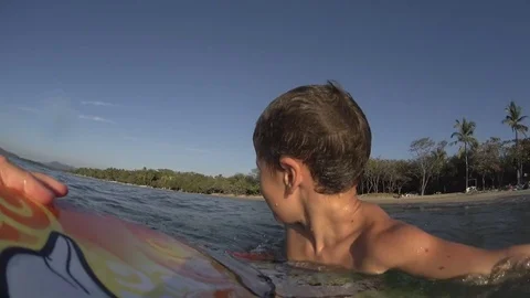 Boy / kid surfing - jumping waves Body Board at the beach, surfing, surf Stock Footage 76757355