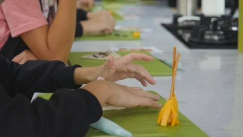 Boy in kitchen during cooking classes making dough cookie Stock Footage 106398958