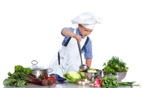 Boy kitchener in chef's hat Fotos de archivo