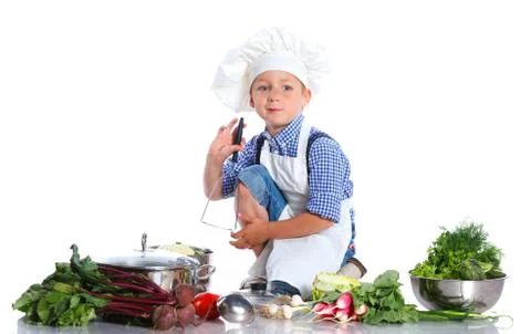 Boy kitchener in chef's hat Fotos Stock