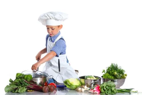 Boy kitchener in chef's hat 스톡 사진