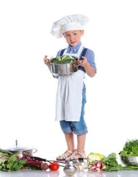 Boy kitchener in chef's hat Stock Photos