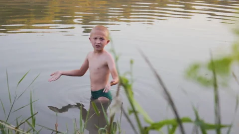 Boy in the lake Stock Footage 225106790