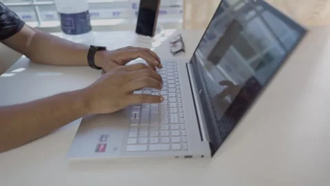 A boy laptop fast typing by hand on white table Stock Footage 290789089
