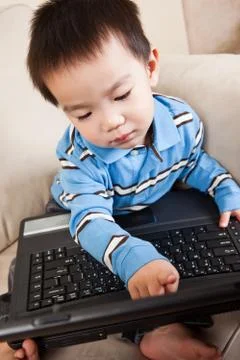 Boy with laptop Stock Photos
