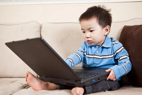 Boy with laptop Stock Photos