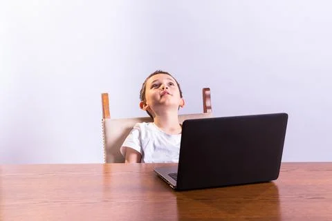 Boy with laptop Stock Photos