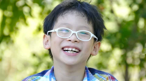 Boy laughing in garden Stock Footage 59615488