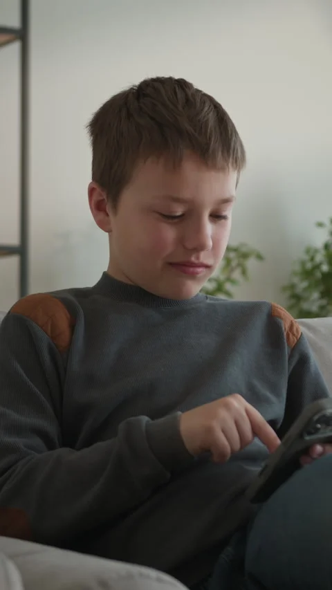 Boy Laughing While Using Tablet Stock Footage 335486719
