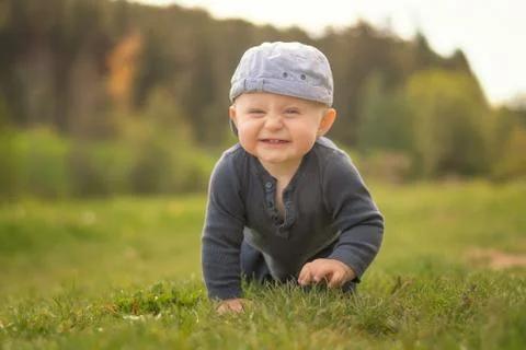 The boy laughs at the camera. Stock Photos