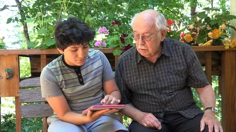 Boy laughs at grandfather Stock Footage 89376482