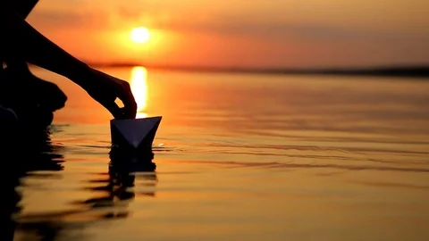 Boy Launching Paper Boat Stock Footage 79753358