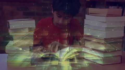Boy leaning over textbook and scanning lines generating neon-green grid overlay Stock Footage 312280276