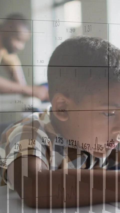 Boy leaning on table, tracking device receiving data and showing study via grid Stock Footage 332335525