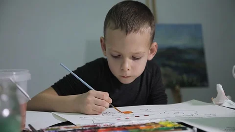 The boy learn to draw paints on paper. Watercolor. Children's drawing. Stock Footage 98818532