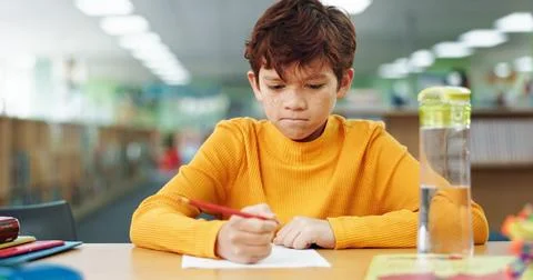 Boy, learning and paper with thinking at library for test, study and development Stock Photos
