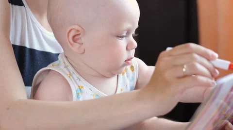 Boy learning handwriting practice from mother Stock Footage 63432863