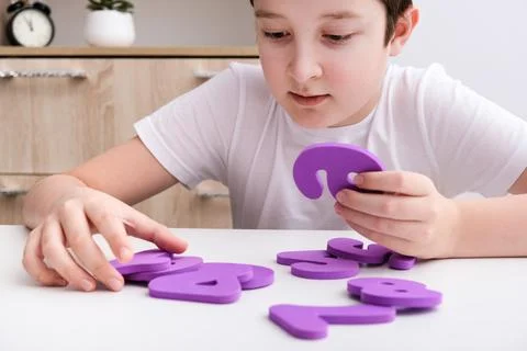 A boy learning math, count exercises at home Stock Photos