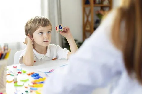 Boy Learning Numbers in Educational Setting Stock Photos