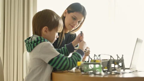 Boy learning online in coding robot car and electronic board in STEM Stock Footage 237524217